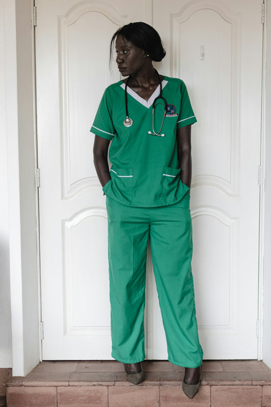 A woman in green scrubs with a stethoscope.